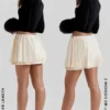 Emira Ivory Pleated Mini Skirt